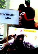 An activist at a protest march in New Delhi on Monday seeking tabling of the AIDS/HIV bill 